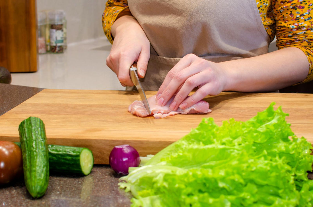 Cut Raw Meat on a Wood Cutting Board